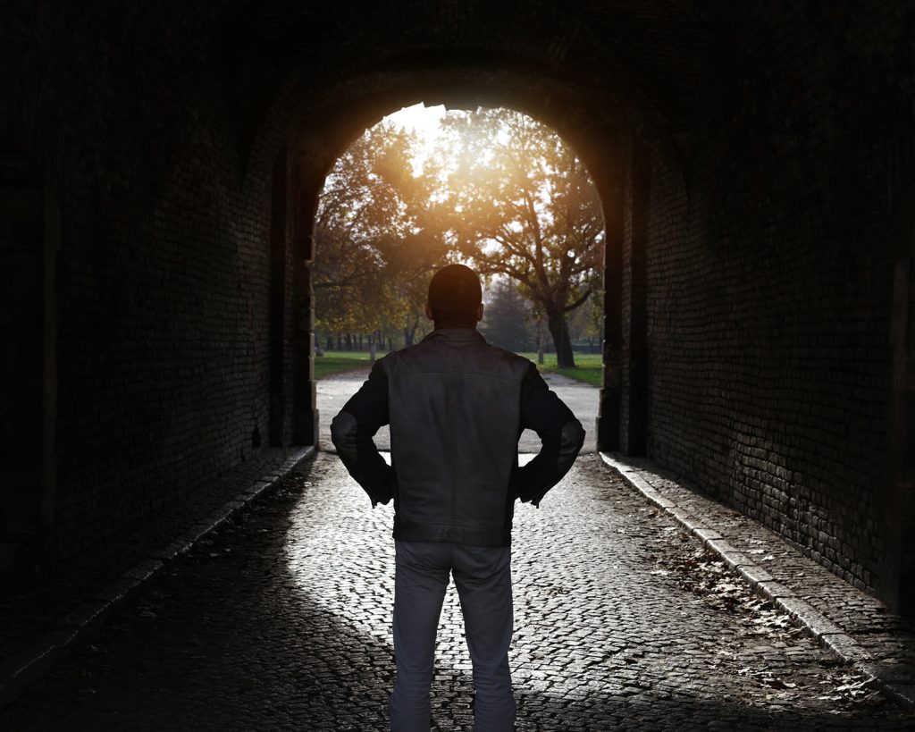a man standing in a tunnel