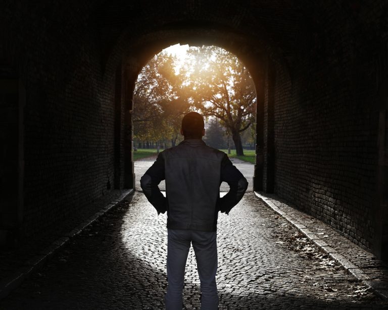 a man standing in a tunnel