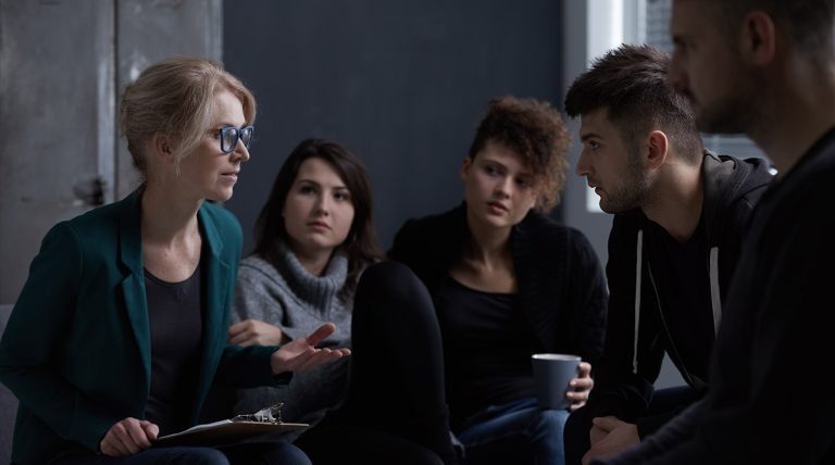 a group of people sitting in a circle