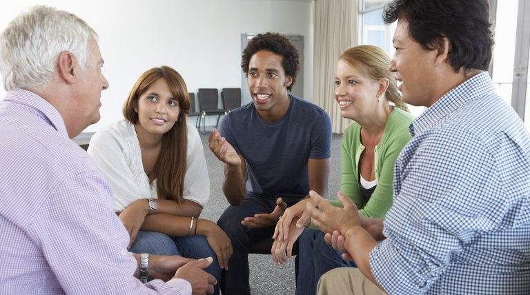 a group of people sitting in a circle