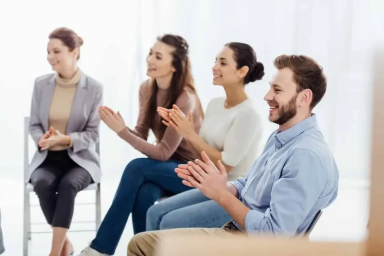 a group of people clapping