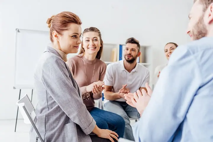 a group of people sitting in a circle